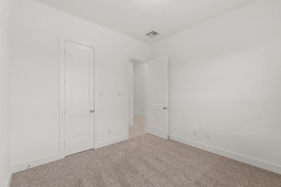 Representative unfurnished interior of a home built from the Mickelson by Chesmar Homes in Riceland Alley Loads, Mont Belvieu (Image 93).