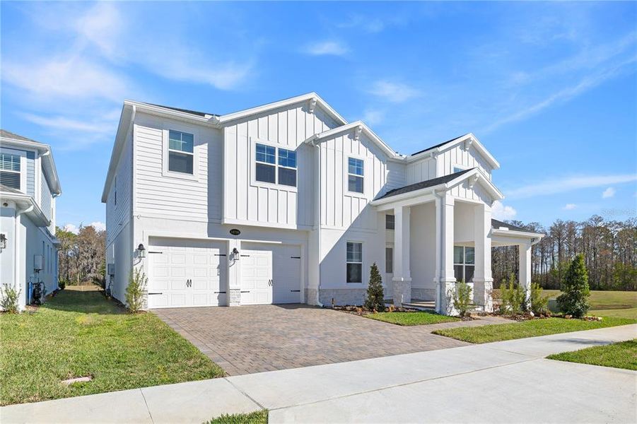 Front exterior of a new home in , Winter Garden, FL, highlighting curb appeal (Image 28).