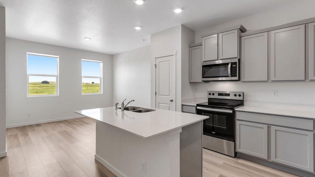 Representative furnished interior of a home built from the PALMER by D.R. Horton in Vista Meadows, Fort Lupton (Image 4).