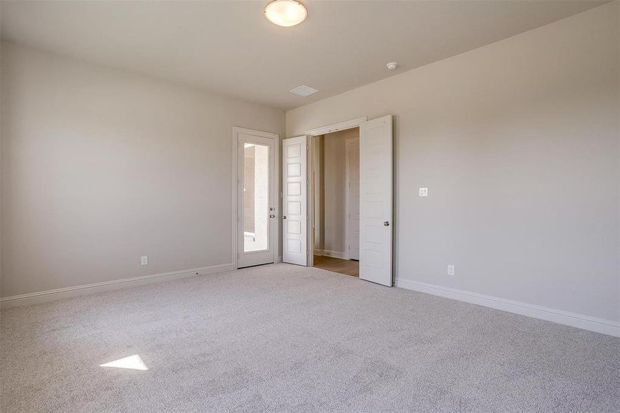 Unfurnished bedroom featuring carpet