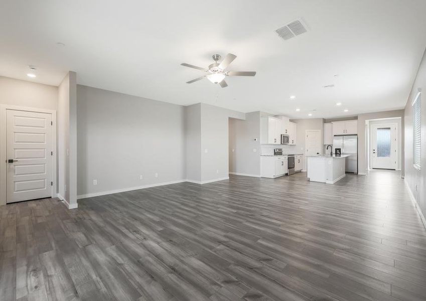 Open-concept layout that connects the kitchen, dining area, and living room.