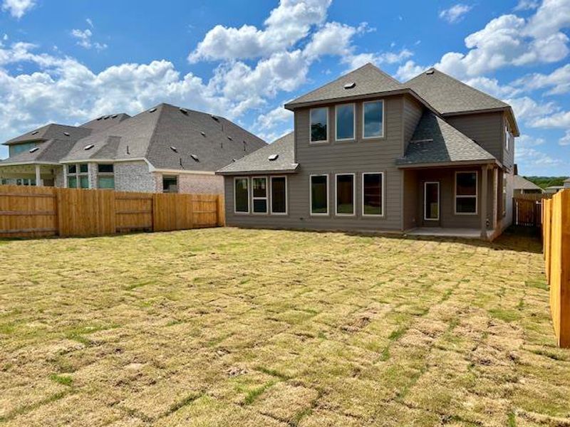 Front exterior of a new home in Oaks at San Gabriel, Georgetown, TX, highlighting curb appeal (Image 13). Front exterior of a new home in Oaks at San Gabriel, Georgetown, TX, highlighting curb appeal (Image 13).