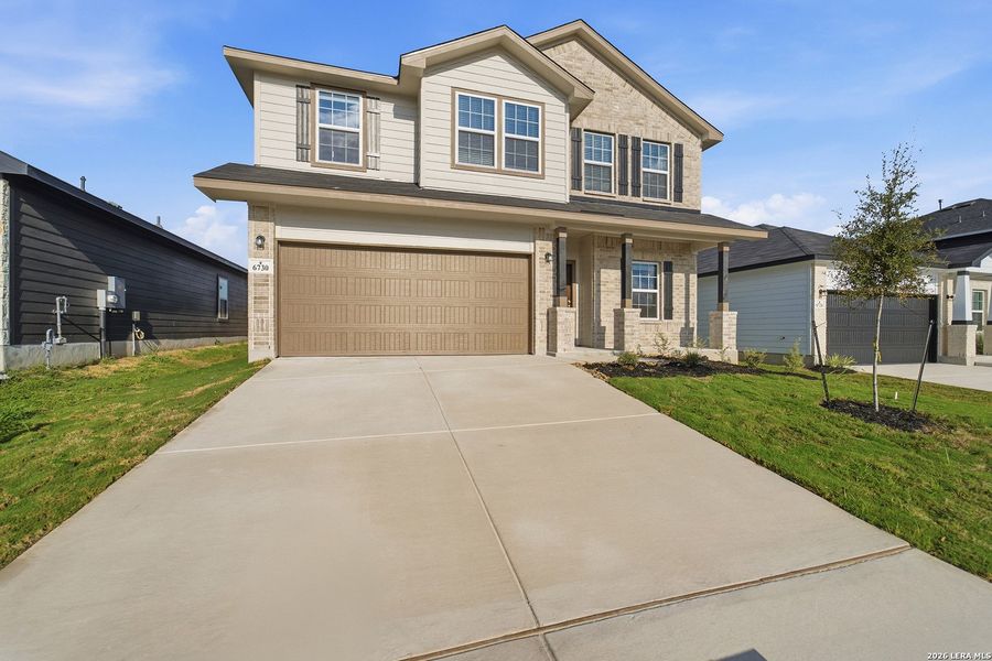 Front exterior of a new home in Morgan Meadows, San Antonio, TX, highlighting curb appeal (Image 2).