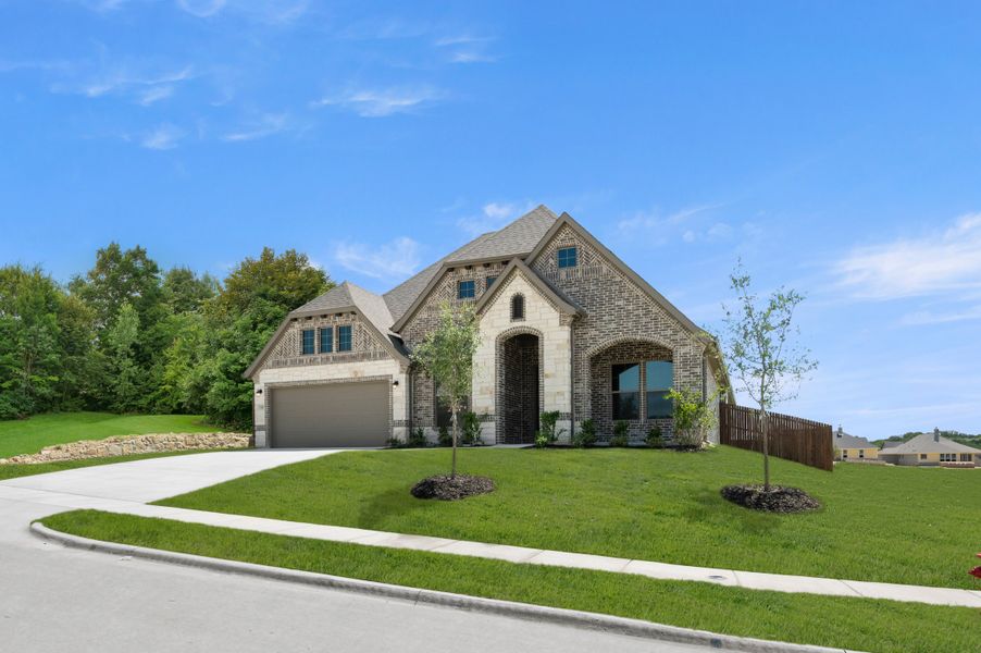 Front exterior of a new home in Waterford Park, Weatherford, TX, highlighting curb appeal (Image 2). Front exterior of a new home in Waterford Park, Weatherford, TX, highlighting curb appeal (Image 2).