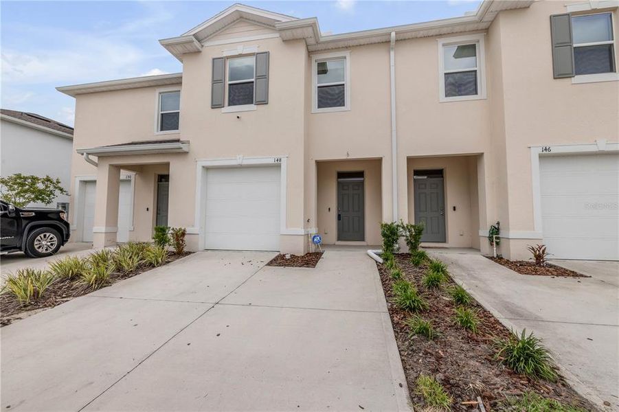 Front exterior of a new home in , Daytona Beach, FL, highlighting curb appeal (Image 2). Front exterior of a new home in , Daytona Beach, FL, highlighting curb appeal (Image 2).