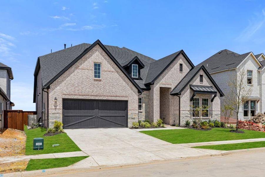 Representative exterior photo of a completed home built from the Grayson by UnionMain Homes in Cambridge Crossing, Celina, TX (Image 30).
