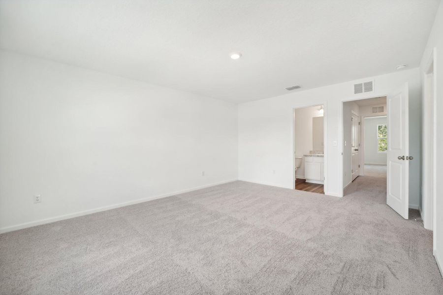 Spacious, unfurnished interior of a new home in Aster Towns, Summerville (Image 11).