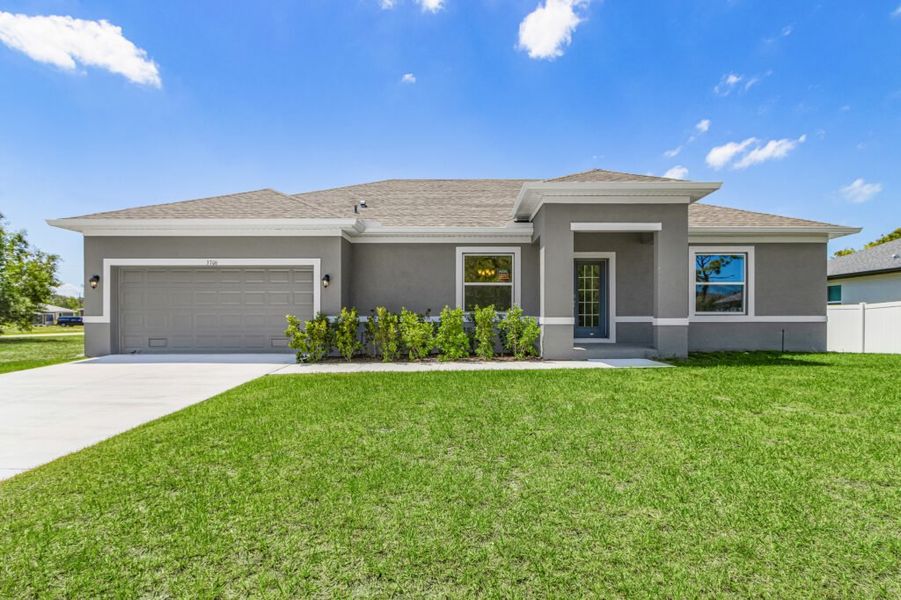 Front exterior of a new home in Cape Coral, Cape Coral, FL, highlighting curb appeal (Image 1). Front exterior of a new home in Cape Coral, Cape Coral, FL, highlighting curb appeal (Image 1).