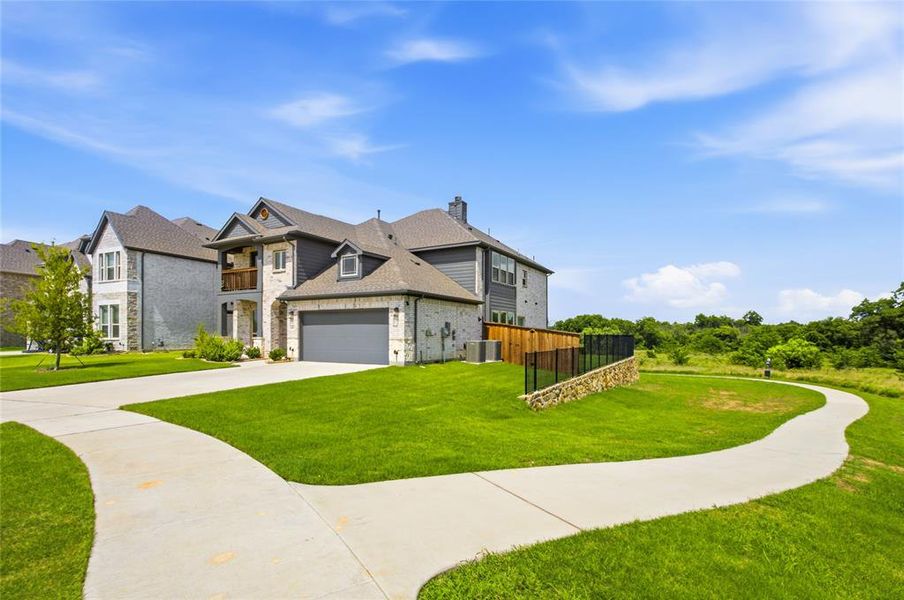 Front exterior of a new home in , Providence Village, TX, highlighting curb appeal (Image 2). Front exterior of a new home in , Providence Village, TX, highlighting curb appeal (Image 2).