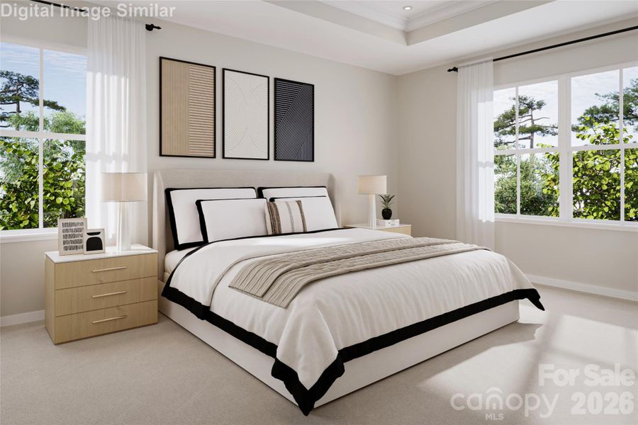 The primary bedroom is filled with natural light, creating a serene sanctuary where you can unwind and decorate to your personal taste.