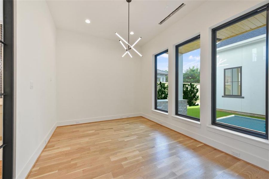 The clean sleek lines and contemporary fixtures offer a transitional feel to the warm wood and large windows of this custom home.