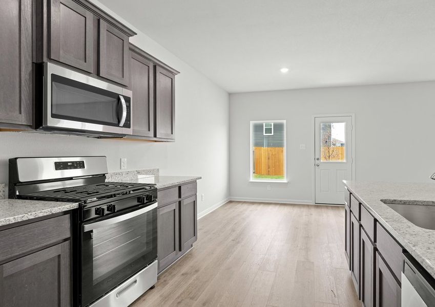 The dining room sits right off of the kitchen. The dining room sits right off of the kitchen.