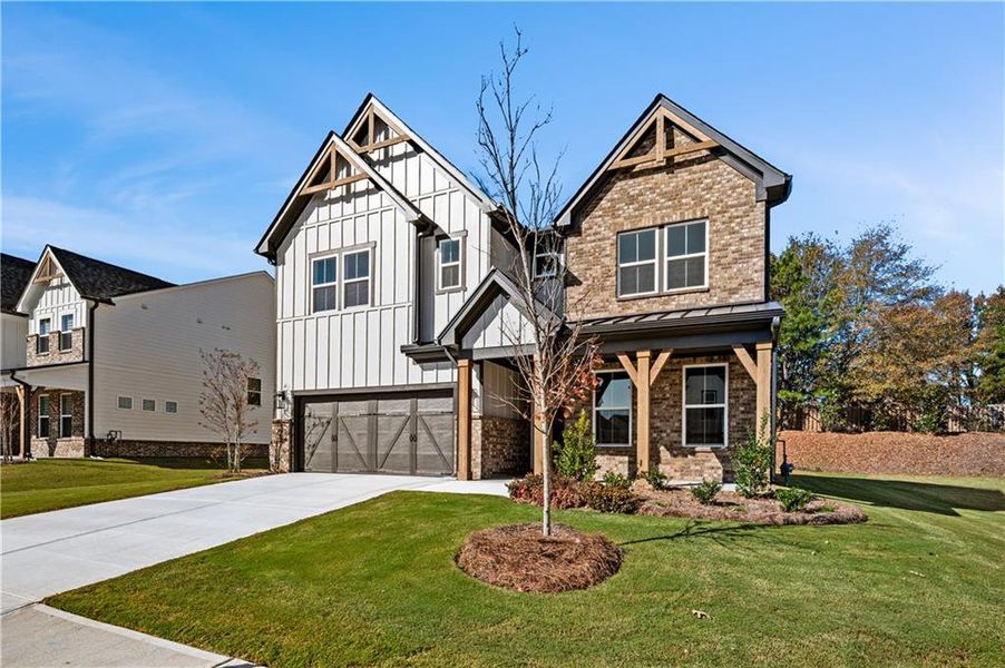 Front exterior of a new home in The Paddocks at Doc Hughes, Buford, GA, highlighting curb appeal (Image 27).