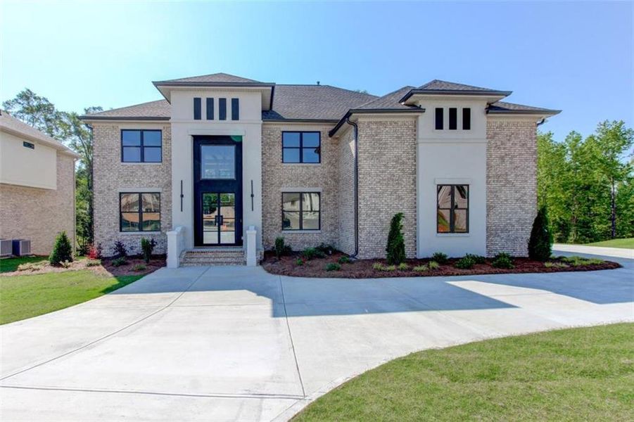 Front exterior of a new home in , Conyers, GA, highlighting curb appeal (Image 2). Front exterior of a new home in , Conyers, GA, highlighting curb appeal (Image 2).