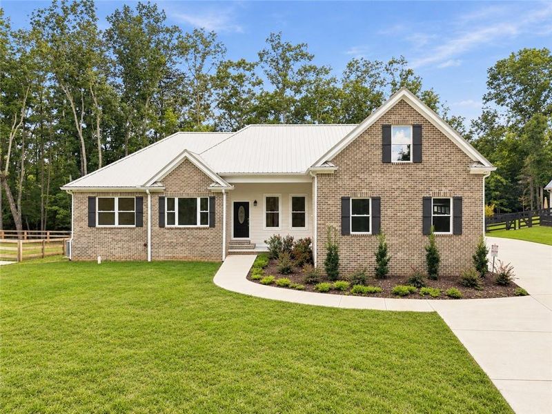 Front exterior of a new home in , Canton, GA, highlighting curb appeal (Image 1). Front exterior of a new home in , Canton, GA, highlighting curb appeal (Image 1).