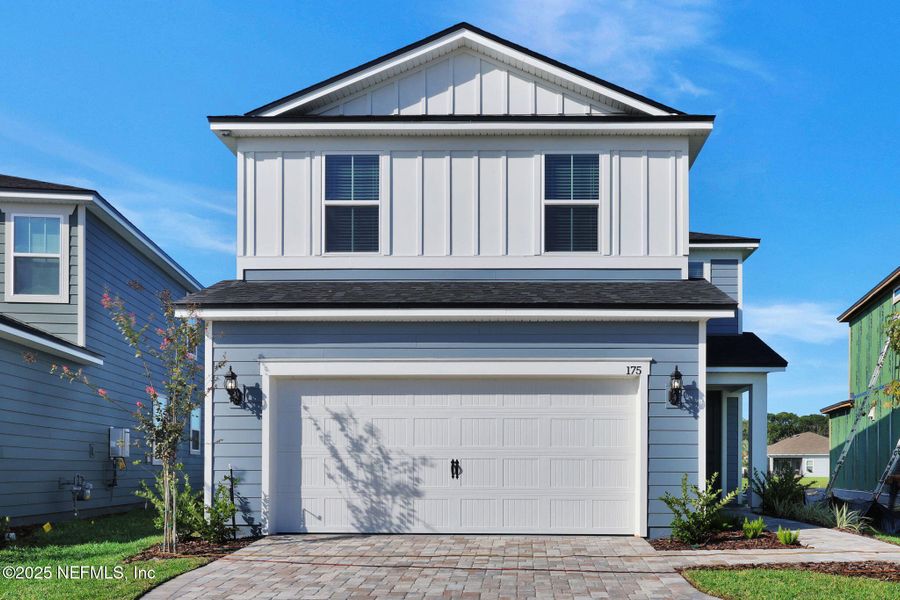 Front exterior of a new home in The Preserve at Bannon Lakes, St. Augustine, FL, highlighting curb appeal (Image 1). Front exterior of a new home in The Preserve at Bannon Lakes, St. Augustine, FL, highlighting curb appeal (Image 1).