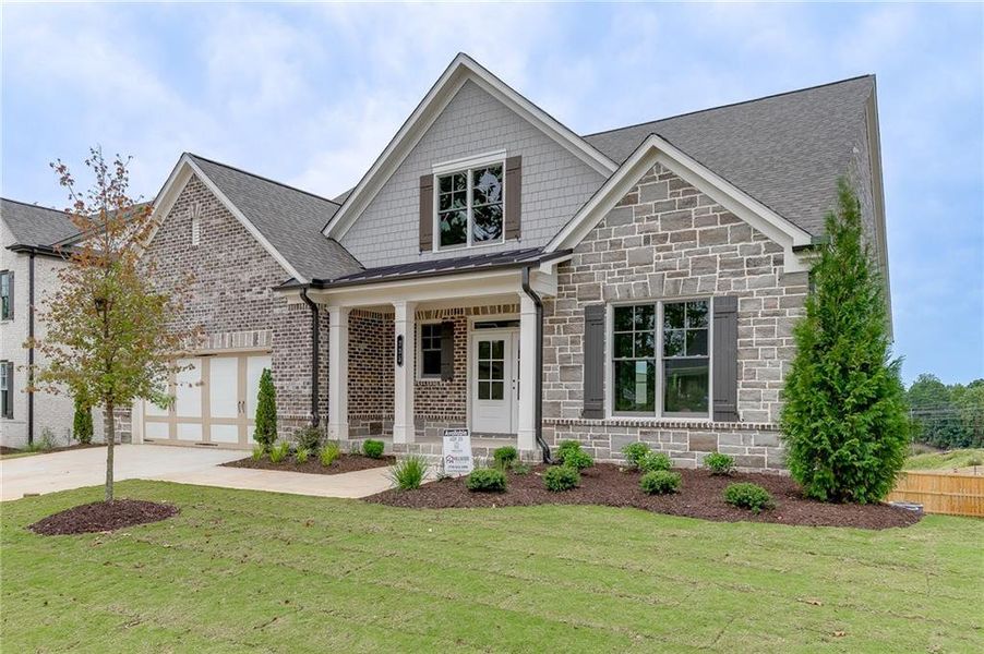 Front exterior of a new home in , Buford, GA, highlighting curb appeal (Image 10).