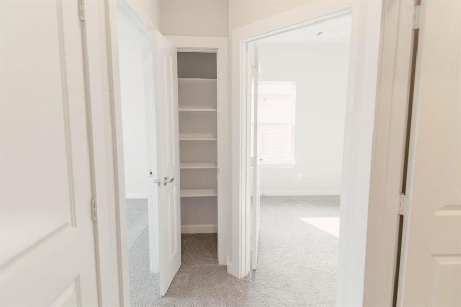 Hallway with carpet flooring