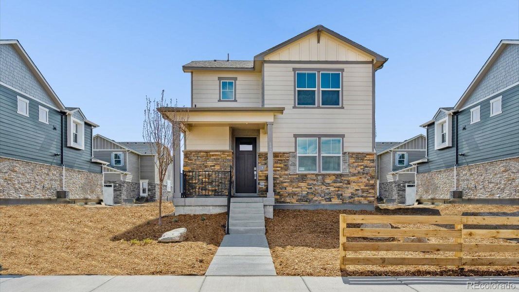 Front exterior of a new home in Horizon Uptown, Aurora, CO, highlighting curb appeal (Image 1).