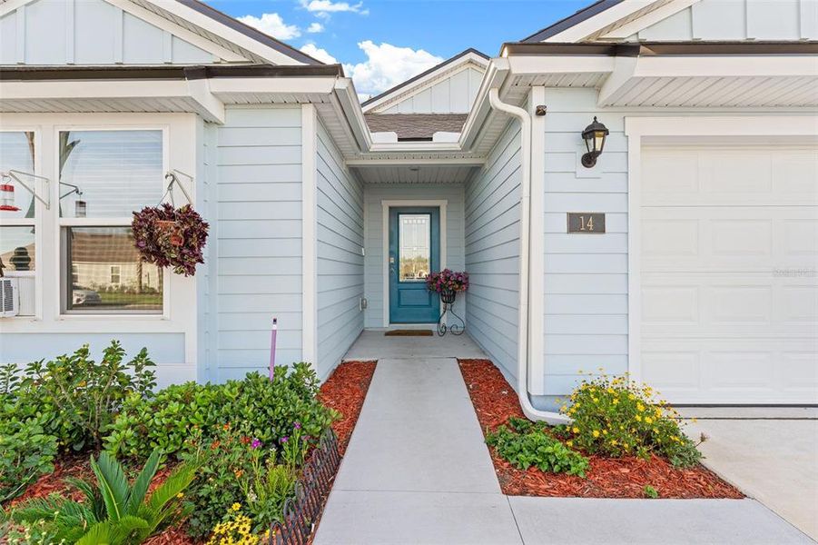 Front exterior of a new home in Sawmill Branch, Palm Coast, FL, highlighting curb appeal (Image 23).