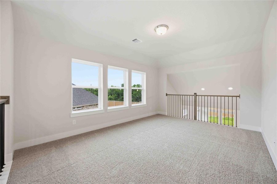 Spacious, unfurnished interior of a new home in Ellwood, Iowa Colony (Image 30).