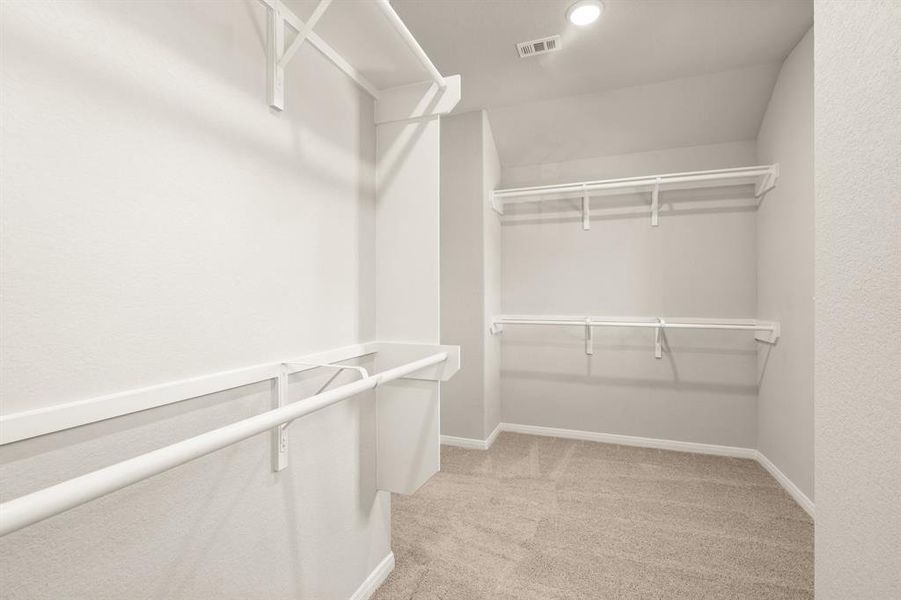 A view of your large primary walk-in Closet