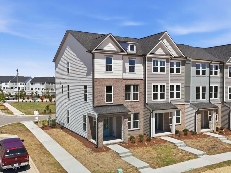 Front exterior of a new home in Forestville Yard Townhomes, Knightdale, NC, highlighting curb appeal (Image 2). Front exterior of a new home in Forestville Yard Townhomes, Knightdale, NC, highlighting curb appeal (Image 2).