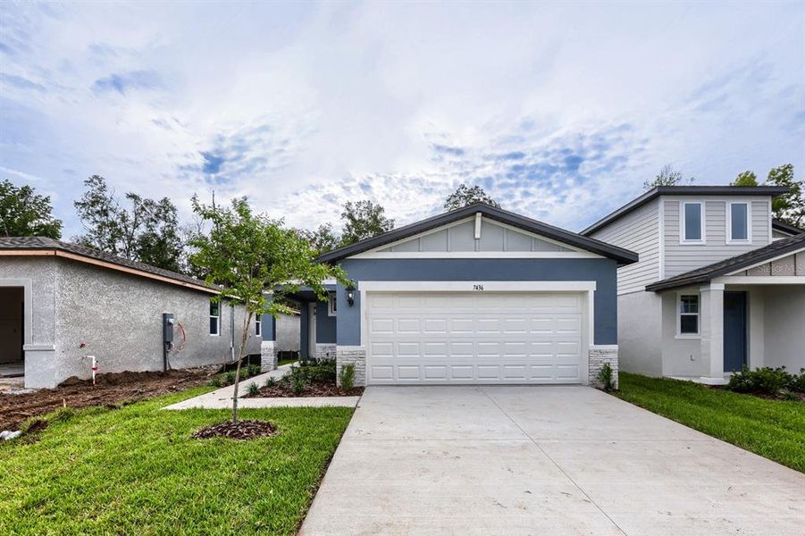 Front exterior of a new home in Leyland Preserve - Premier Series, Brooksville, FL, highlighting curb appeal (Image 1). Front exterior of a new home in Leyland Preserve - Premier Series, Brooksville, FL, highlighting curb appeal (Image 1).