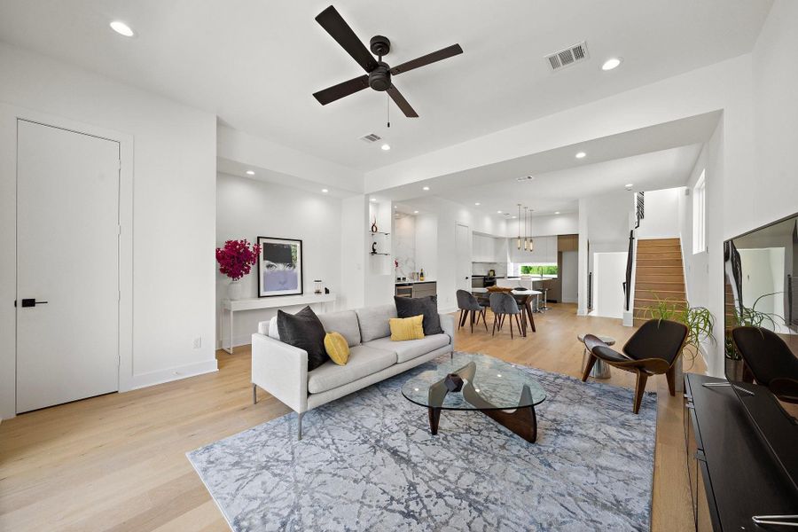 This inviting modern living room is designed with comfort and style in mind. Expansive windows flood the space with natural light, highlighting the clean lines and neutral tones throughout. This inviting modern living room is designed with comfort and style in mind. Expansive windows flood the space with natural light, highlighting the clean lines and neutral tones throughout.