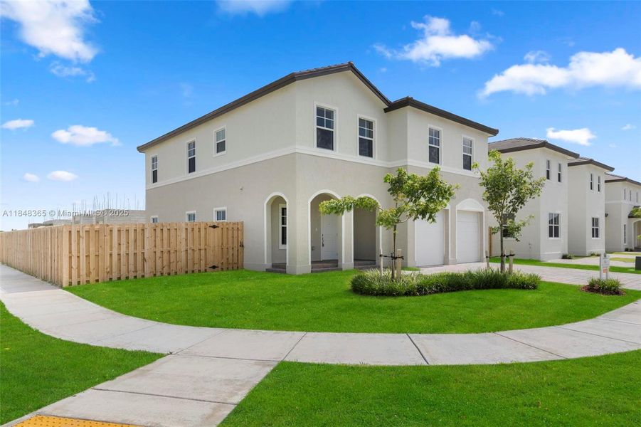 Front exterior of a new home in , Homestead, FL, highlighting curb appeal (Image 19).