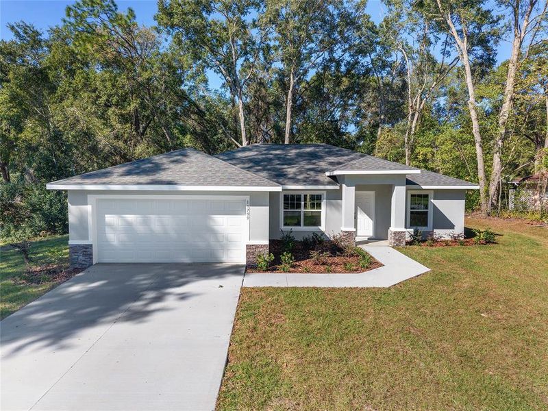 Front exterior of a new home in , Dunnellon, FL, highlighting curb appeal (Image 26). Front exterior of a new home in , Dunnellon, FL, highlighting curb appeal (Image 26).