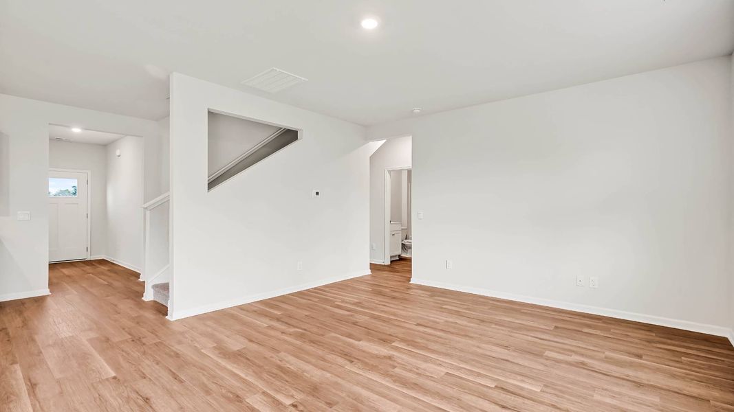 Spacious, unfurnished interior of a new home in Sidbury Station, Castle Hayne (Image 24).