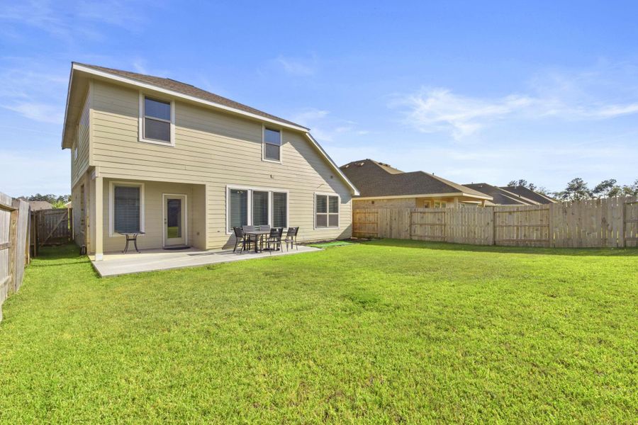 Front exterior of a new home in , Conroe, TX, highlighting curb appeal (Image 2).