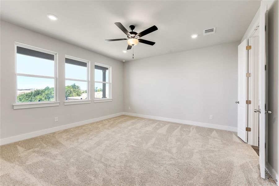 Primary bedroom with ample natural light.