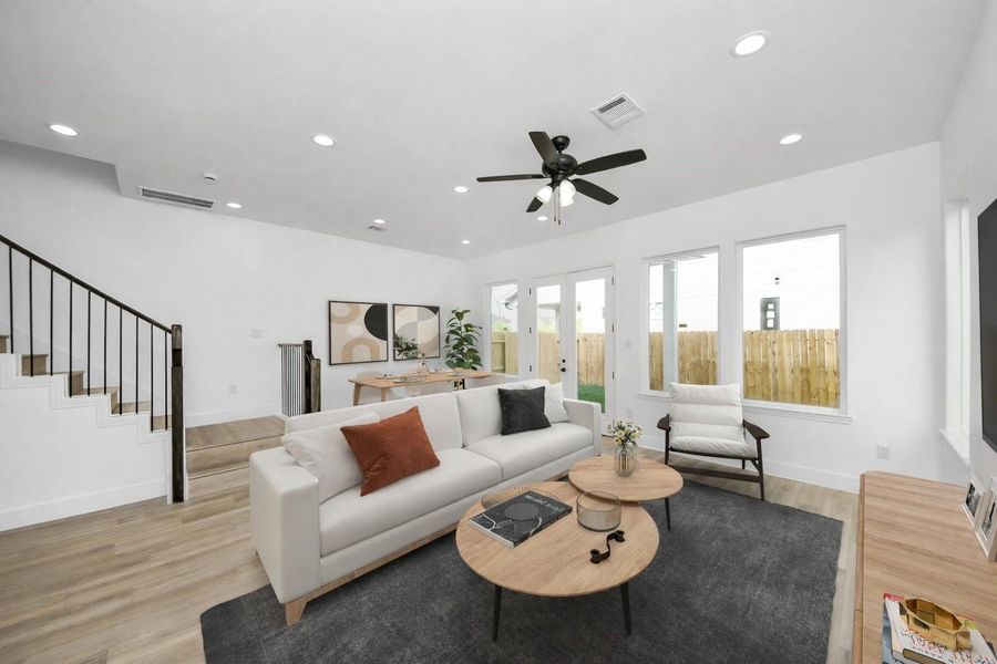 Bright and inviting living space with abundant natural light, an open layout, and seamless access to the backyard—perfect for relaxing or entertaining.