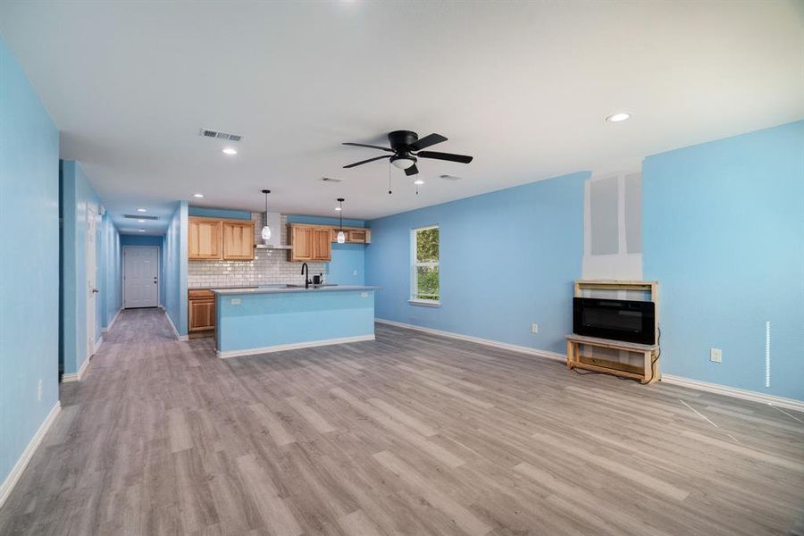 Unfurnished living room featuring dark wood finished floors, recessed lighting, and ceiling fan Unfurnished living room featuring dark wood finished floors, recessed lighting, and ceiling fan