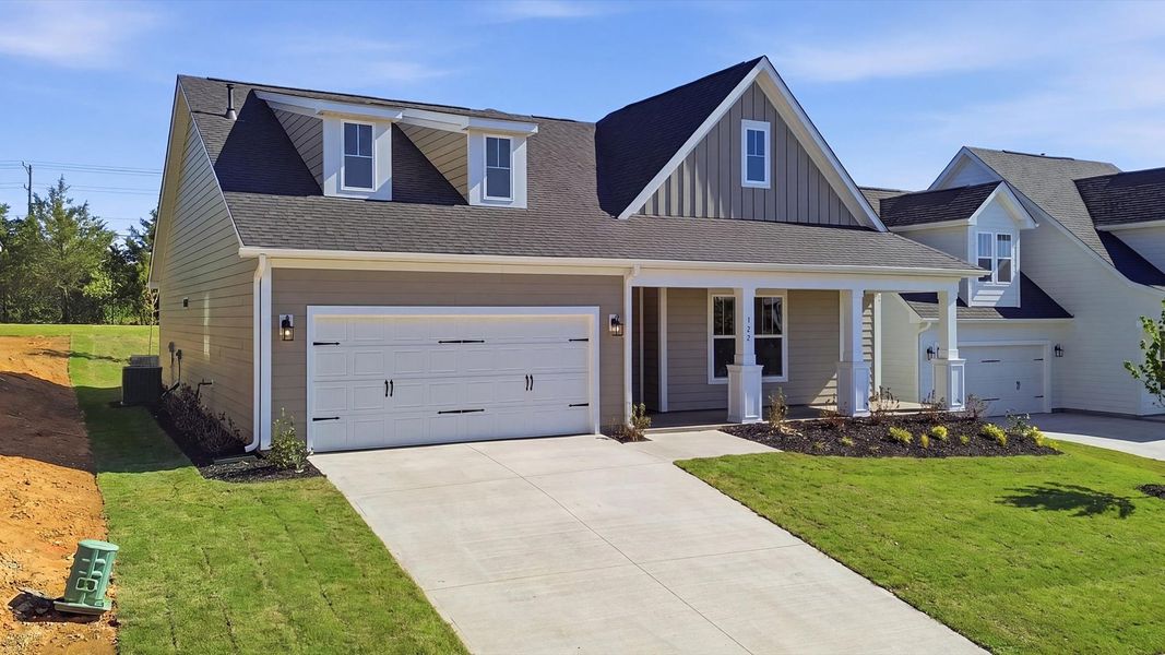 Well-appointed exterior featuring warm tones and designer-selected finishes located at the Benjamin's Grove community Well-appointed exterior featuring warm tones and designer-selected finishes located at the Benjamin's Grove community