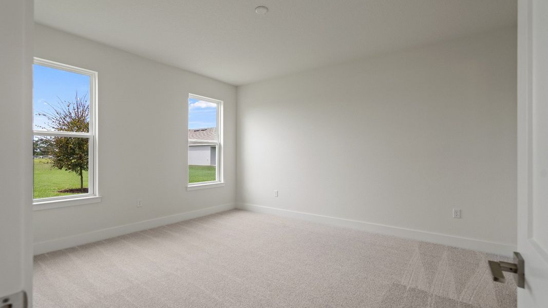 Bedroom in the Buttonwood floorplan by DRB Homes at Lakeside at Satilla in Saint Cloud, FL