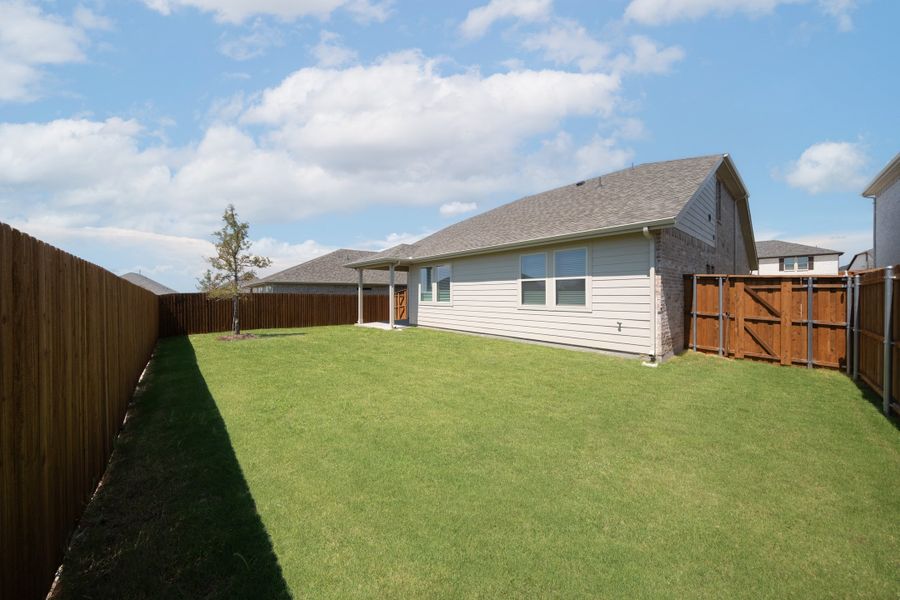 Exterior details and patio area of a home in The Villages of Hurricane Creek, Anna (Image 2).
