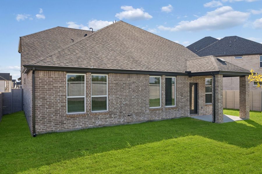 Exterior details and patio area of a home in Painted Tree Woodland West, McKinney (Image 21).