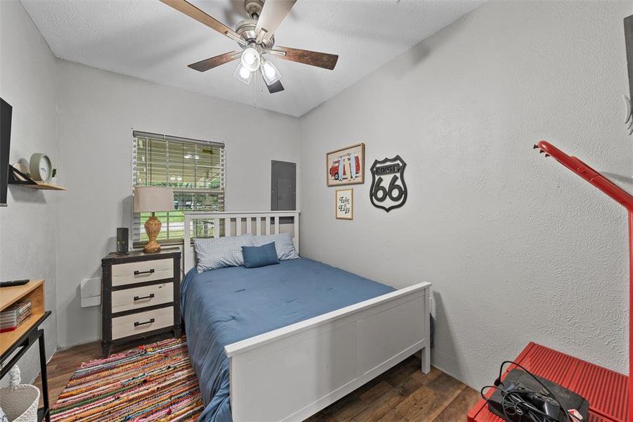 Bedroom featuring wood finished floors and a ceiling fan Bedroom featuring wood finished floors and a ceiling fan