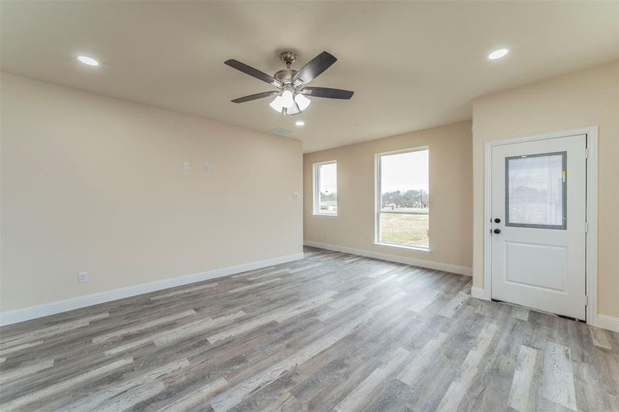 Unfurnished room featuring light hardwood / wood-style flooring and ceiling fan