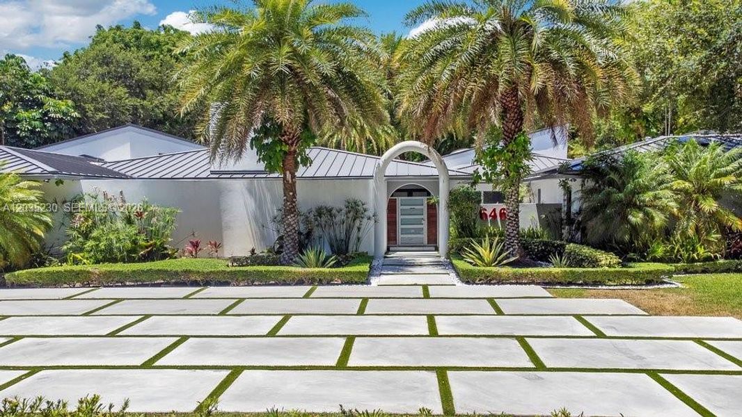 Front exterior of a new home in , Pinecrest, FL, highlighting curb appeal (Image 1). Front exterior of a new home in , Pinecrest, FL, highlighting curb appeal (Image 1).