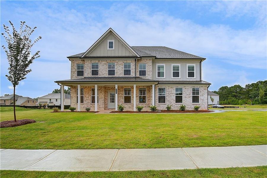 Front exterior of a new home in Westwind Estates, Hampton, GA, highlighting curb appeal (Image 18).
