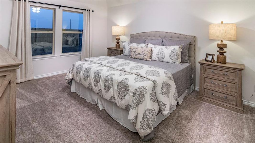 Bedroom featuring carpet Bedroom featuring carpet