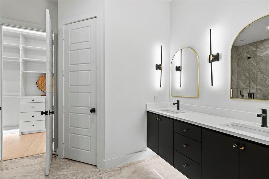 Bathroom featuring vanity and a shower