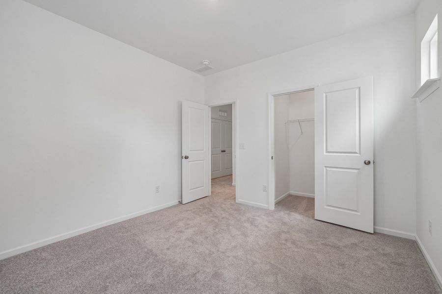 Spacious, unfurnished interior of a new home in Terraces at the Exchange, Indian Land (Image 31).