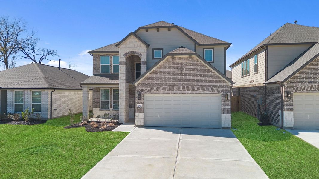 Front exterior of a new home in Barton Creek Ranch, Conroe, TX, highlighting curb appeal (Image 19).