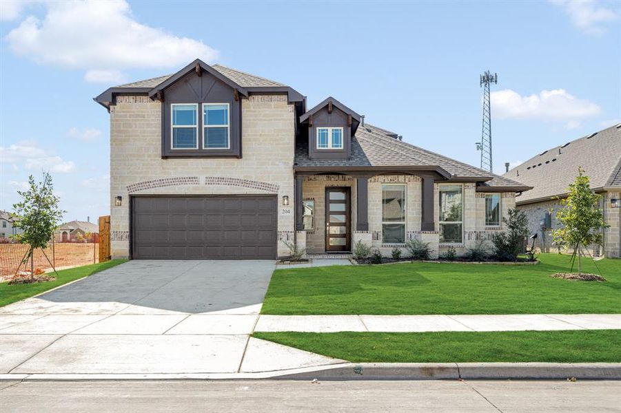 Front exterior of a new home in East Oak Creek 50-55, Commerce, TX, highlighting curb appeal (Image 2). Front exterior of a new home in East Oak Creek 50-55, Commerce, TX, highlighting curb appeal (Image 2).