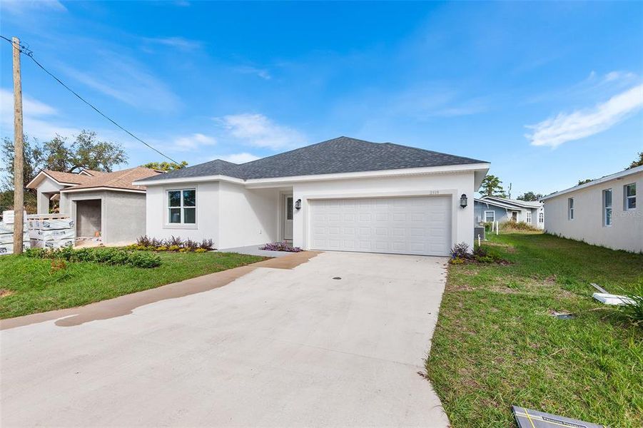 Front exterior of a new home in , Winter Haven, FL, highlighting curb appeal (Image 17). Front exterior of a new home in , Winter Haven, FL, highlighting curb appeal (Image 17).